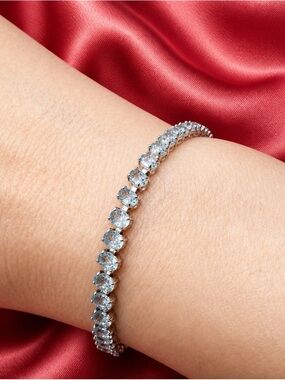 Aquamarine tennis bracelet set in rhodium over 925 Sterling Silver. Brand new